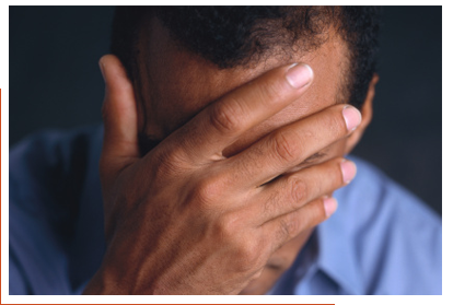 Man with his head in his hands